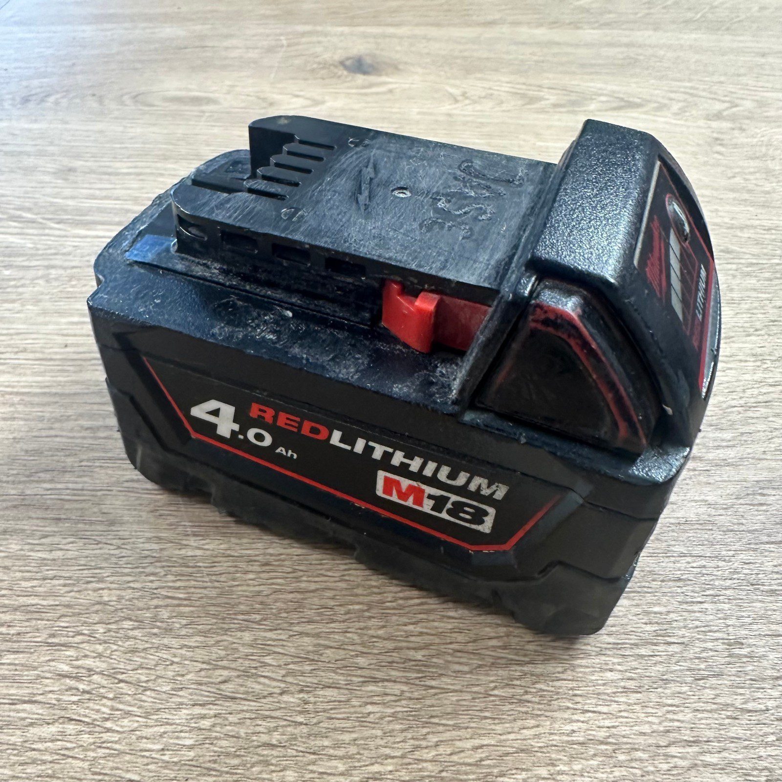 Milwaukee M18B4 18V 4.0Ah Red Lithium Battery Used Genuine - Image 1
