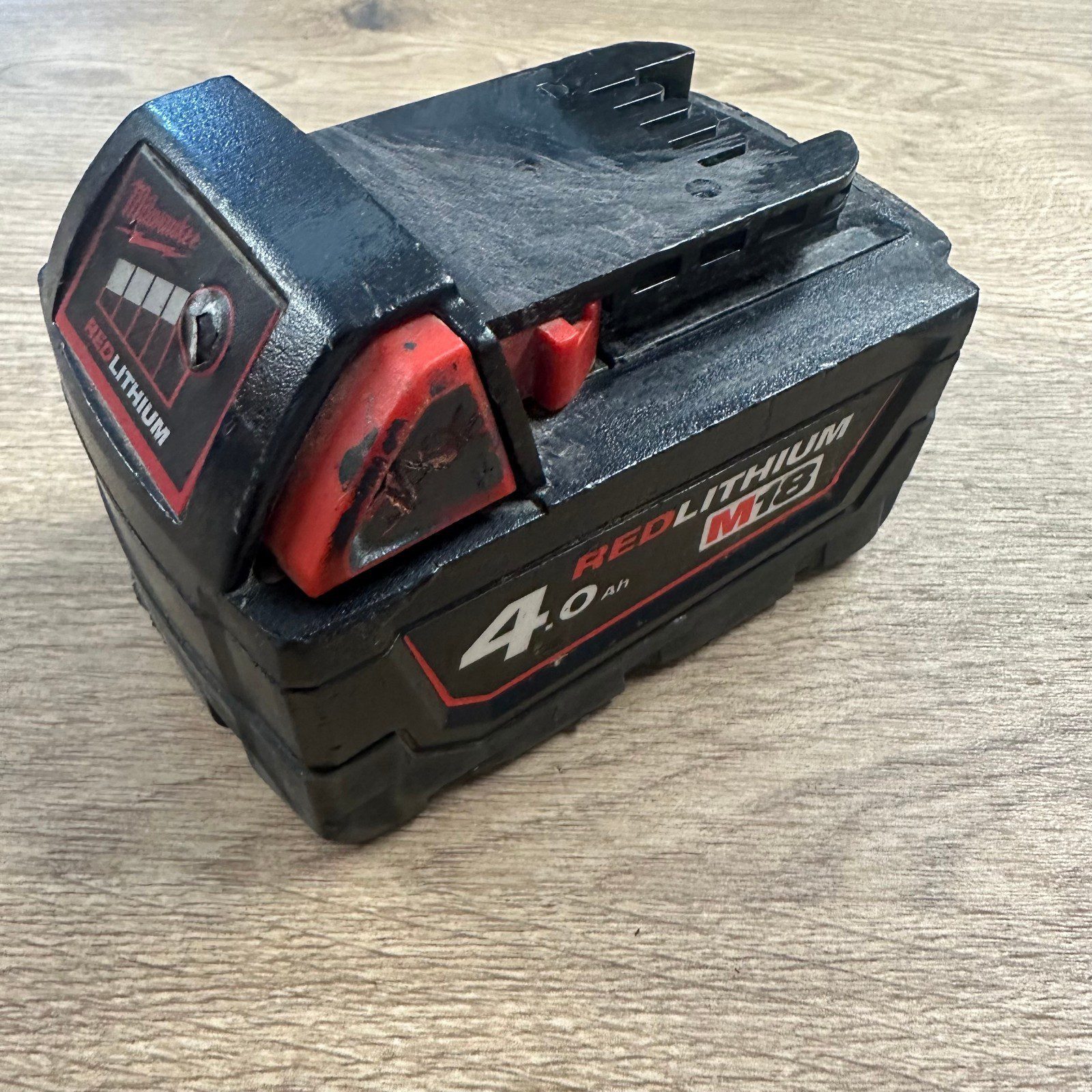 Milwaukee M18B4 18V 4.0Ah Red Lithium Battery Used - Image 1